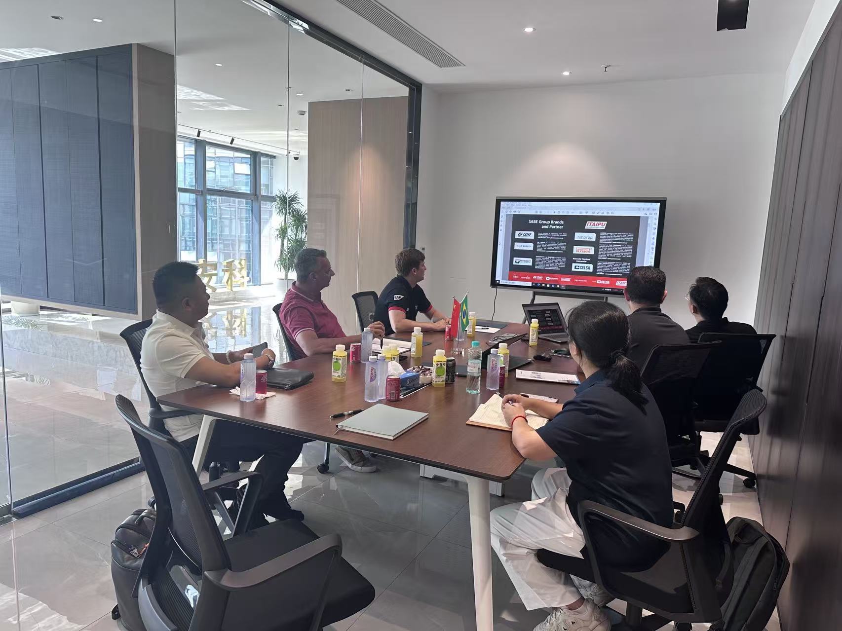 Customer and Pomanique teams reviewing technical information during a FAT visit